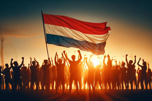 Gruppe af mennesker, der hejser Hollands flag